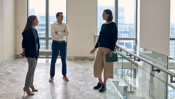 Three people chatting in stairway
